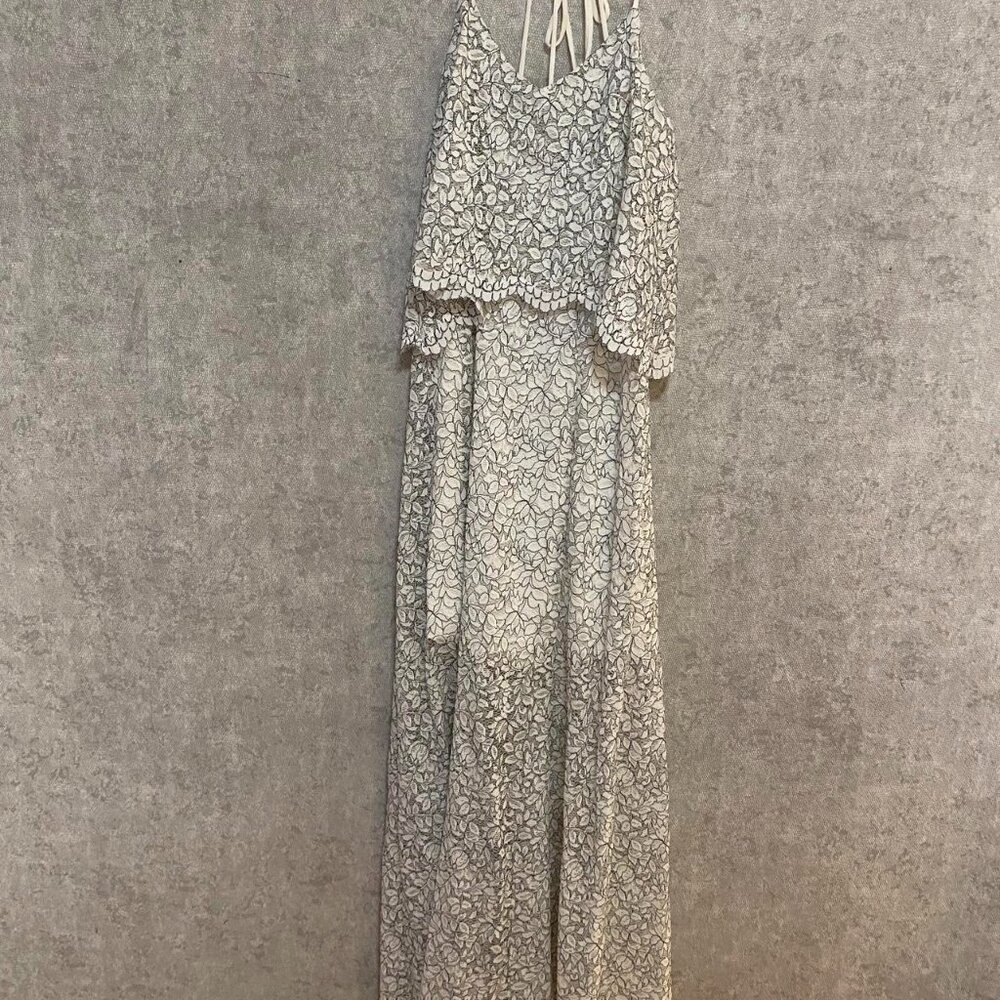 White lace maxi dress with open back, perfect for a special occasion